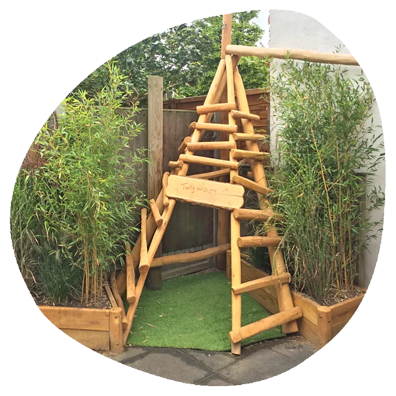 A garden with a ladder made out of wood.